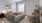 a bedroom with a bed and a fan