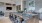 a kitchen with a bar and chairs