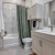 a bathroom with a tub toilet and sink