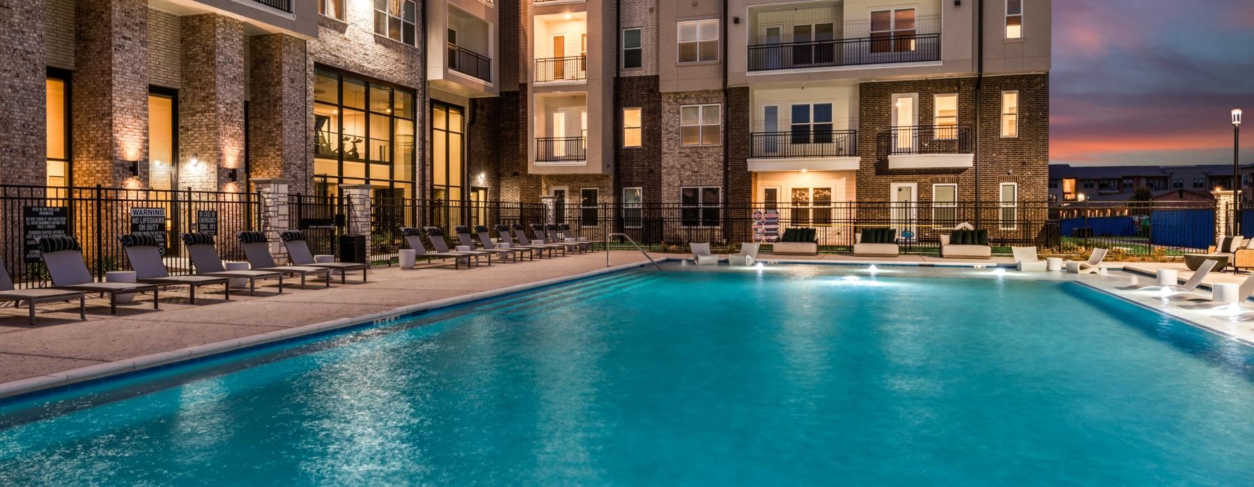 a swimming pool in front of a building