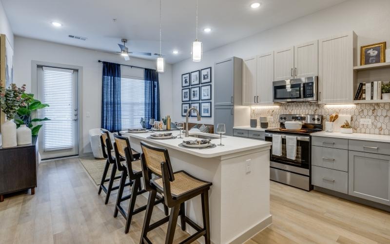 a kitchen with a dining table and chairs