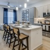 a kitchen with a dining table and chairs